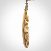 A handcarved masterpiece. A complex twist pendant carved from bone by Yuri Terenyi for NZ Pacific. This is a true piece of wearable art which is collectible. A one-off masterpiece and quite unique. Delivered with Express Courier and gift wrapped in a woven kete pouch.